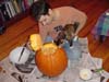 Kyle carving a pumpkin