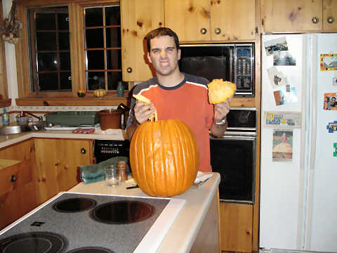 Kyle carving a pumpkin