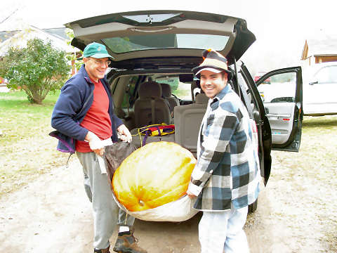 Joseph and David move a pumpkin